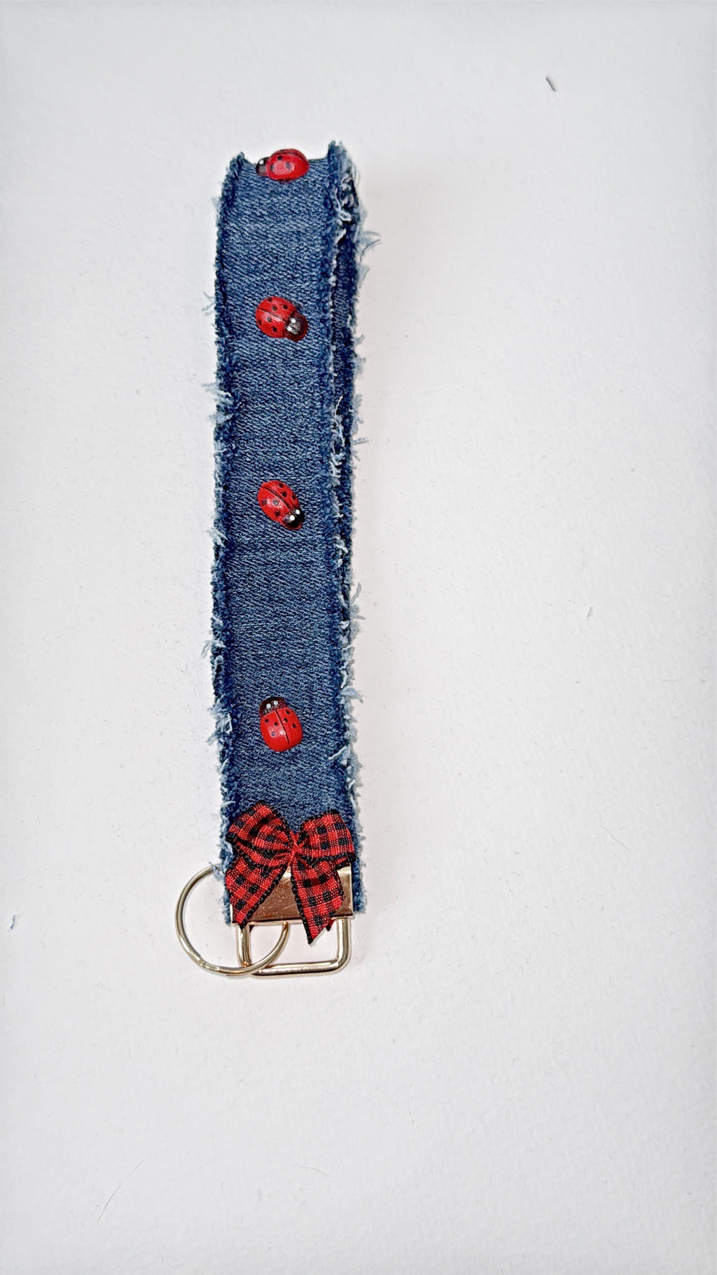 wristlet keychain - dark denim with wood 2D ladybug embellishment